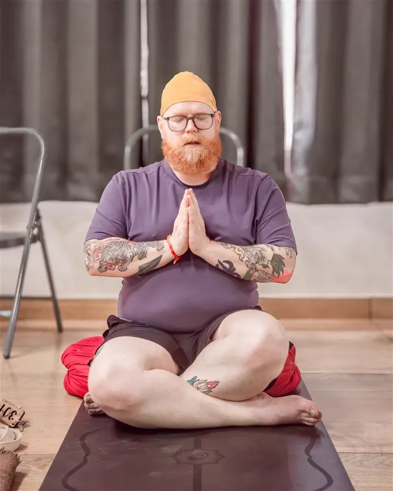 Teacher demonstrating yoga alignment posture