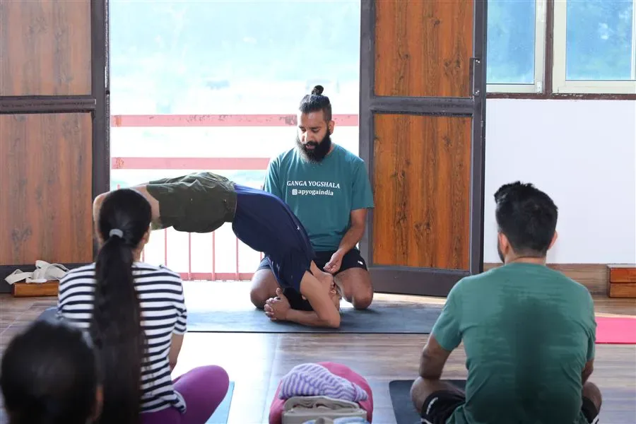 Ganga Yogshala teacher hands-on adjustment