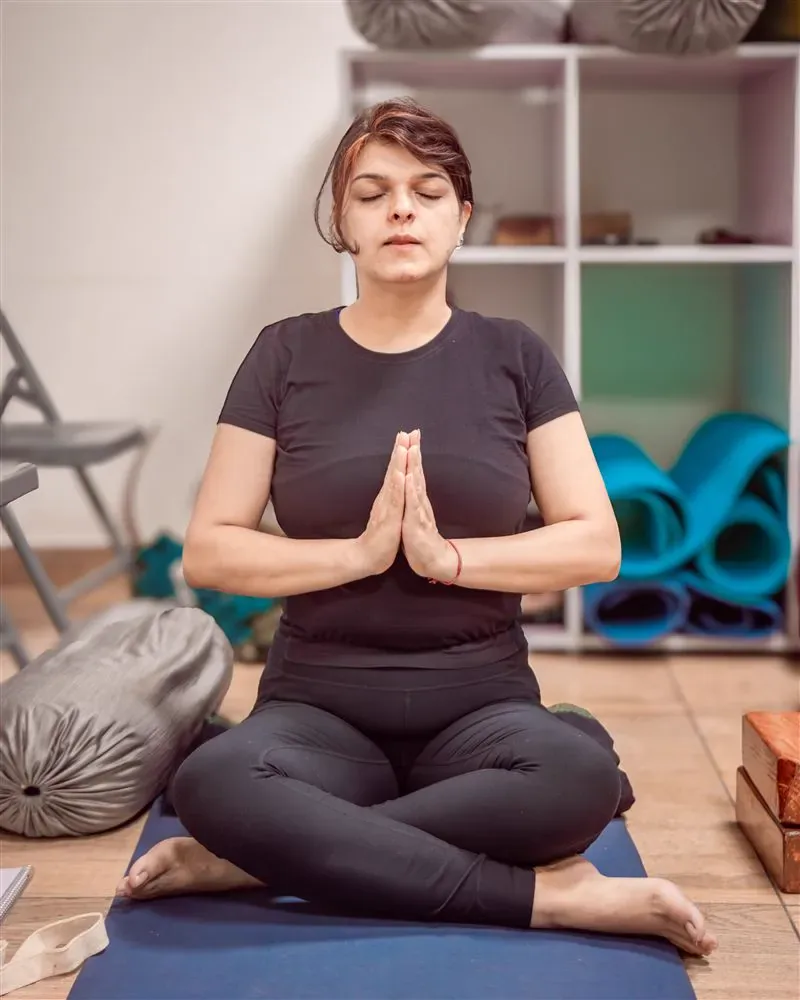 Yogasana posture alignment guidance at Ganga Yogshala