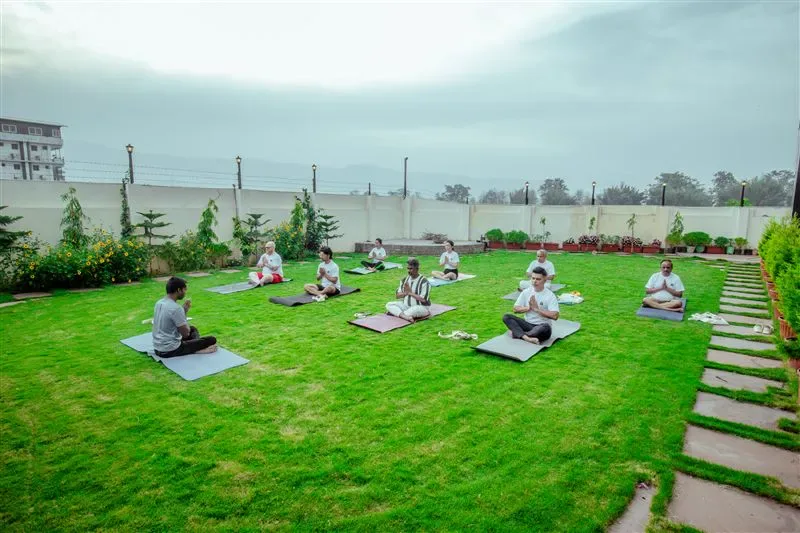Outdoor Hatha practice in Rishikesh garden shala